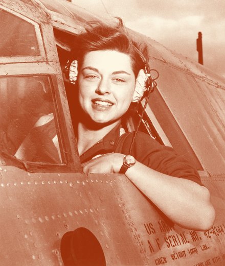 WASP pilot smiling from a cockpit window, about 1943.
