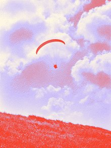 Paraglider wing high above the treetops.